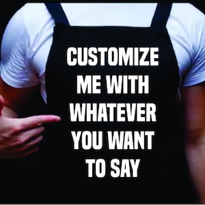Pode incluir: Uma pessoa vestindo um avental preto com texto branco que diz "Customize me with whatever you want to say".