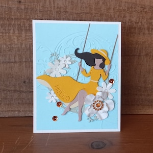 Lady on Swing in Flowing Yellow Dress Handmade Hello Greeting Card, Breezy Swing with Woman Surrounded by Bejeweled Flowers