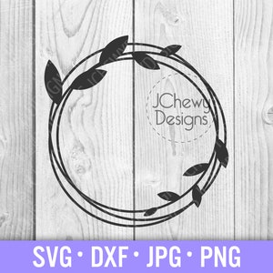 May include: Black and white silhouette of a wreath with leaves. The wreath has a double outline and the text "JChewy Designs" is inside the wreath.