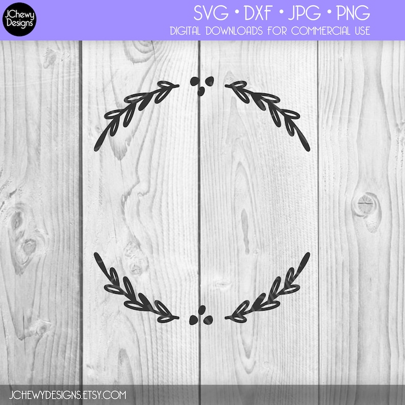 May include: A black and white wreath design with two sets of leaves and berries. The design is on a white wood background.