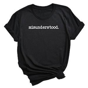 May include: Black t-shirt with white text that reads "misunderstood."