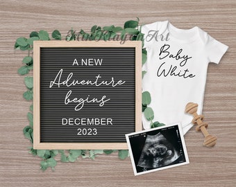May include: A black letter board with the text "A new adventure begins December 2023". A white onesie with the text "Baby White" is next to the letter board. A black and white ultrasound image and a wooden rattle are also in the image.