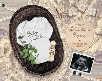 May include: A white baby onesie with the text "Baby Smith" on it, a wooden sign that says "A New Adventure Begins November 2023", a wooden rattle, and a baby ultrasound image.