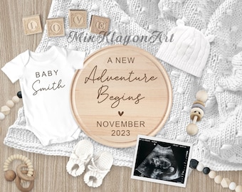 May include: A wooden round sign with the text "A New Adventure Begins" and the date "November 2023".  A white baby onesie with the text "Baby Smith" is next to the sign.  There are wooden blocks spelling "LOVE" and a white knitted baby hat.