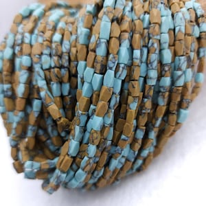 May include: A strand of turquoise and brown gemstone beads. The beads are faceted and have a square shape. The beads are strung on a wire and are ready to be used for jewelry making.