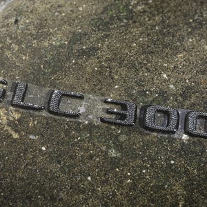 Original OEM | Mercedes Benz Logo GLC300 AMG | Coupe Limo Writing Emblem Batch with original Preciosa® crystals icy iced tuning