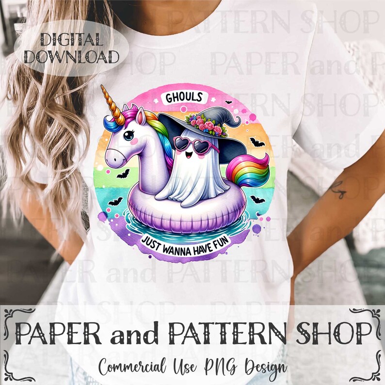 May include: A white t-shirt with a colorful graphic of a ghost wearing a witch hat and sunglasses riding an inflatable unicorn with the text "Ghouls Just Wanna Have Fun".