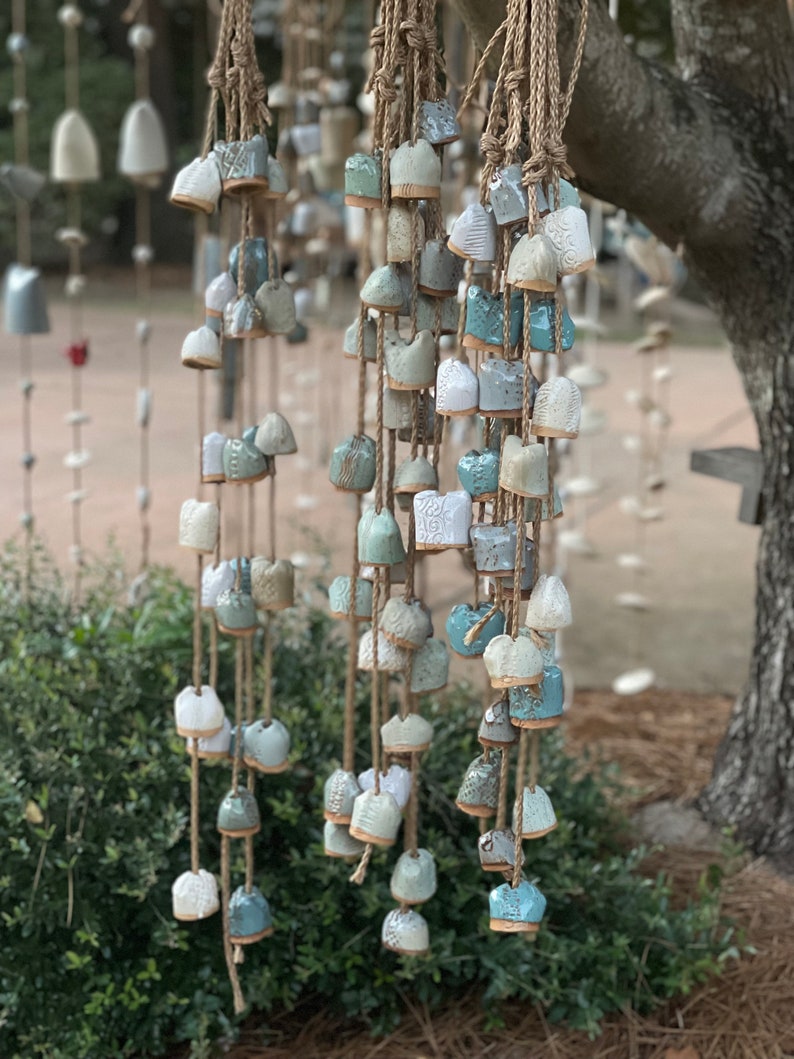 This photo shows multiple sets hung together. If you’re interested in purchasing more than 3 strands, or even more than 3 bells per strand, we can create a custom look for you!  Just email or message me!