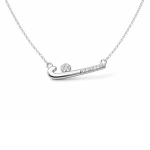 May include: A silver necklace with a hockey stick pendant and a ball. The hockey stick is adorned with small, clear gemstones. The necklace chain is delicate and silver. The pendant is a sports-themed jewellery item.