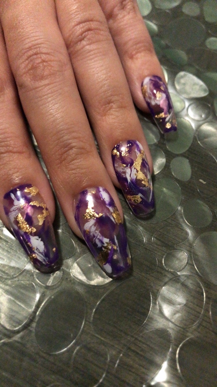 Dress your nails to impress with this marbled amethyst nail art with gold  flakes! - Lucy's Stash