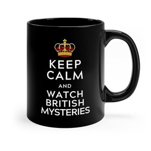 May include: Black ceramic coffee mug with a white design that says "Keep Calm and Watch British Mysteries". A gold crown is above the text.