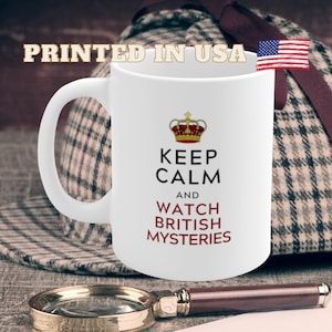 May include: White ceramic mug with a red and gold design. The mug features a crown and the text "Keep Calm and Watch British Mysteries".