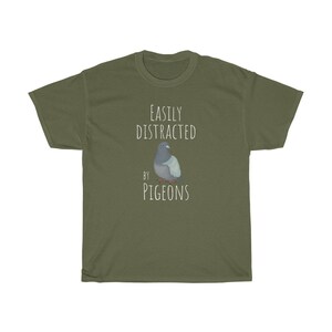 May include: A green t-shirt with the text "Easily Distracted by Pigeons" and a cartoon pigeon illustration.