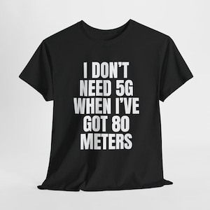 May include: Black t-shirt with white text that reads "I don't need 5G when I've got 80 metres".