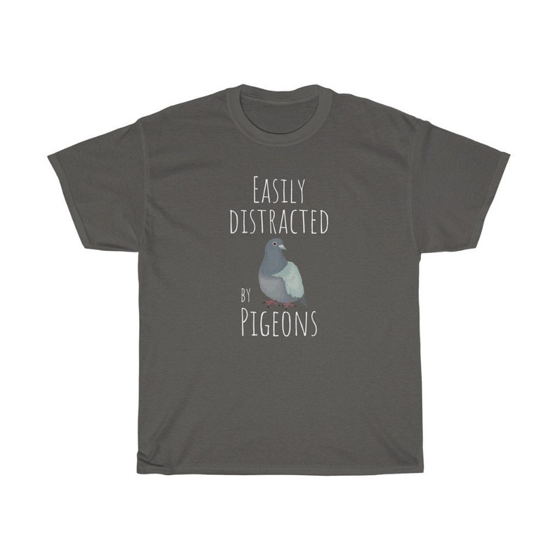 May include: A dark grey t-shirt with the text "EASILY DISTRACTED BY PIGEONS" and a cartoon image of a pigeon.