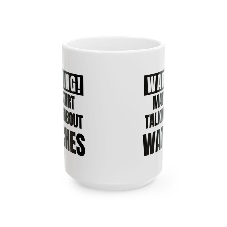 May include: White ceramic mug with black text that reads "WARNING! May Start Talking About Watches". The mug is cylindrical with a slightly flared base and a simple handle. A great gift for watch enthusiasts.