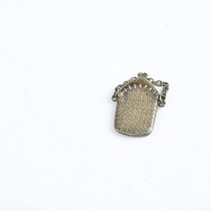 Whitemetal wallet in miniature