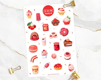 May include: A sheet of stickers featuring a variety of red and pink desserts, including cupcakes, ice cream cones, donuts, and cherries. The stickers are on a white background with red and yellow accents. The text "Art Tales Studio" and "Desserts Set" is printed on the sheet.