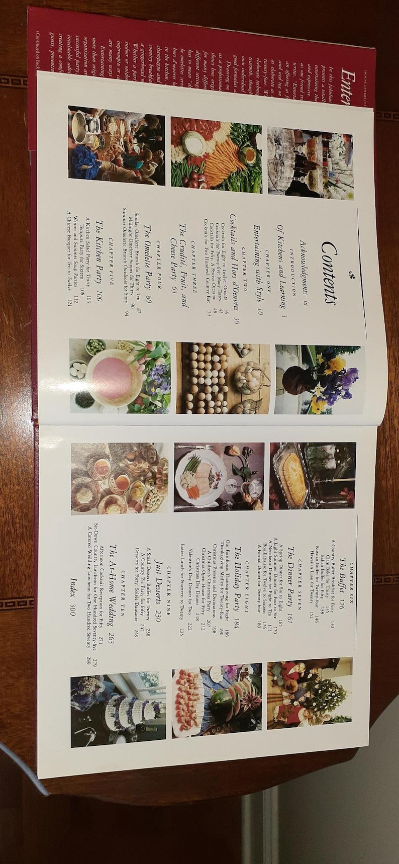 May include: A book cover with a colorful image of a table setting with food and drinks. The book title is "Entertaining with Style" and the subtitle is "Cocktails and Hors d'Oeuvres".
