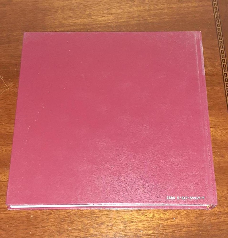 May include: A burgundy hardback book with a white spine and the text "ISBN 0-637-54043-9" printed on the bottom edge.