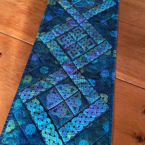 May include: A set of three ceramic mugs with a speckled, matte finish. The mugs are in shades of cream, light gray, and dark gray. Each mug has a simple, minimalist design, perfect for coffee or tea.