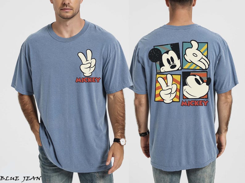 May include: Blue t-shirt with Mickey Mouse graphics. The front has a peace sign hand gesture and the word "Mickey" in red. The back features Mickey's face and hands in a square design. A casual, comfortable tee.