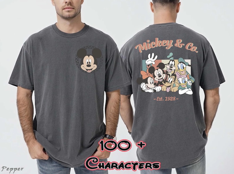 May include: Dark gray t-shirt featuring Mickey Mouse on the front and a group of Disney characters on the back. The back of the shirt has the text "Mickey & Co. - Est. 1928-".