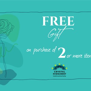 May include: Teal background with the words "FREE Gift" in white, along with the text "on purchase of 2 or more items." A line drawing of a flower and a logo for Crystal Hideaway are also present.
