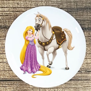 May include: A white horse with a brown saddle and a golden star on its side, standing next to a girl with long blonde hair wearing a purple dress.