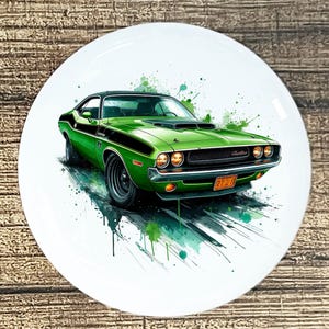 May include: A green classic car with black racing stripes is depicted on a white plate. The car has a black roof and is surrounded by green paint splatters. The license plate reads "2720".