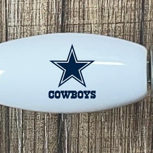 May include: A set of three ceramic mugs with a speckled, matte finish. The mugs are in shades of cream, light gray, and dark gray. Each mug has a simple, minimalist design, perfect for coffee or tea.