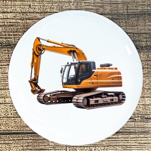 May include: A yellow and black excavator with a long arm and a large bucket. The excavator is on a white background.