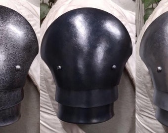 May include: Three metal shoulder pads, each with a different finish. The first is a textured silver, the second is a smooth black, and the third is a smooth silver.