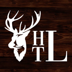 May include: White silhouette of a deer head with antlers, with the letters "HTL" in a block font below it. The image is on a dark brown wood background.