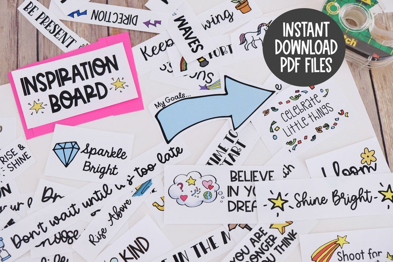 May include: A selection of white cards with motivational phrases and illustrations, including a pink "Inspiration Board" sign. The cards feature phrases like "Sparkle Bright" and "Believe in Your Dreams". A roll of tape is visible.
