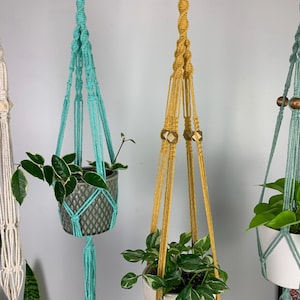 May include: A rustic wooden sign with the text "Welcome to our home" in a handwritten style. The sign features a distressed finish and a simple, inviting design, perfect for a front porch or entryway.