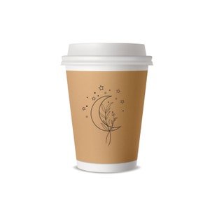 K&ouml;nnte beinhalten: Ein brauner Pappbecher mit wei&szlig;em Deckel. Der Becher hat ein Design mit einem Halbmond, in dem sich ein Blattzweig befindet, und Sternen drumherum.