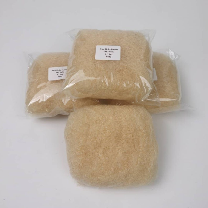 May include: Three packs of Afro kinky human hair bulk, each containing a light brown, fluffy, textured hair bundle. The label on the front pack reads "Afro kinky human hair bulk 8" - 1oz #013".
