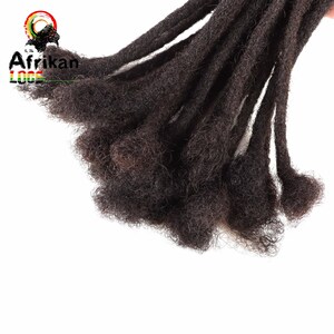 May include: Close-up of dark brown dreadlocks. The dreadlocks are thick and textured, with a natural, unkempt appearance. The image is set against a white background. The text "Afrikan Loops" is visible in the upper left corner.