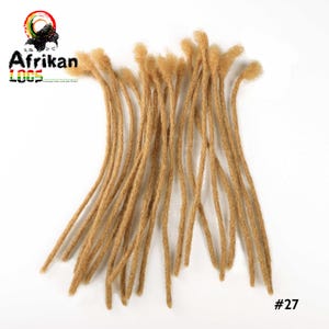 May include: A collection of light brown dreadlocks, arranged on a white background. The dreadlocks are of varying lengths and have a textured appearance. The number 27 is visible in the bottom right corner. The logo for Afrikan Loox is in the top left corner.