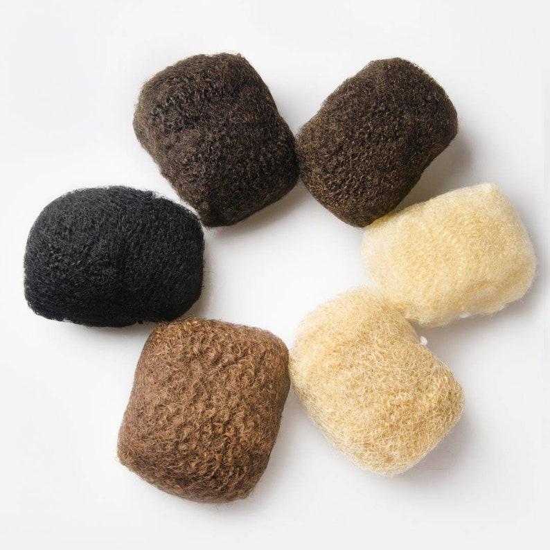 May include: Six hair pieces in different shades of brown and blonde. The hair pieces are arranged in a circle on a white background.