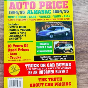 May include: A vintage "Auto Price" almanac from 1994/95, featuring a bright yellow cover with red and green accents. The cover includes information on car and truck prices, with images of a Chevrolet Monte Carlo and a Toyota Land Cruiser. The almanac promises to save money on car purchases.