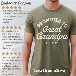 May include: Heather olive green t-shirt with the text "PROMOTED TO Great Grandpa EST. 2025" in white. The shirt is a short-sleeved crew neck style. The shirt is made of a soft, comfortable material.