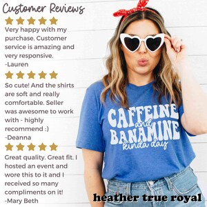 May include: A heather true royal blue t-shirt with the text "CAFFEINE and BANAMINE kinda day" in white. The person in the image is wearing heart-shaped sunglasses and a red bandana.