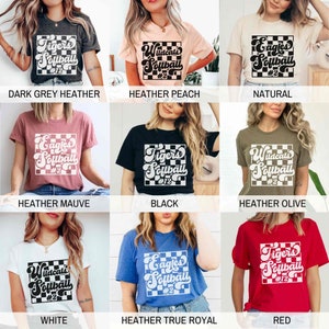 May include: A collage of nine images showcasing different color variations of a t-shirt design. The design features a black and white checkered square with the words "Tigers Softball #12", "Wildcats Softball #2", or "Eagles Softball #2" in a retro font. The t-shirts are available in colors such as dark grey heather, heather peach, natural, heather mauve, black, heather olive, white, heather true royal, and red.
