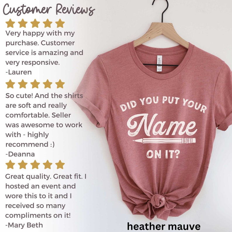 May include: Heather mauve t-shirt with the text "Did you put your name on it?" in white lettering with a pencil graphic.