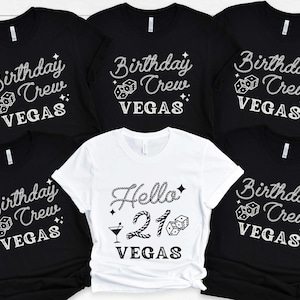 May include: Five black t-shirts with white text and graphics that say "Birthday Crew Vegas" and one white t-shirt with white text and graphics that say "Hello 21 Vegas".