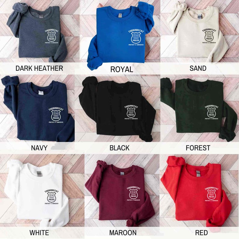 May include: A set of nine sweatshirts in various colors, each featuring a white graphic of a police badge with the text "Thermostat" and "Protect & Serve". The colors include dark heather, royal blue, sand, navy, black, forest green, white, maroon, and red.
