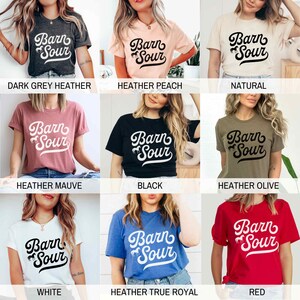 May include: A collection of t-shirts in various colors featuring the text "Barn Sour" with a stylized horse graphic. The colors include dark grey heather, heather peach, natural, heather mauve, black, heather olive, white, heather true royal, and red.