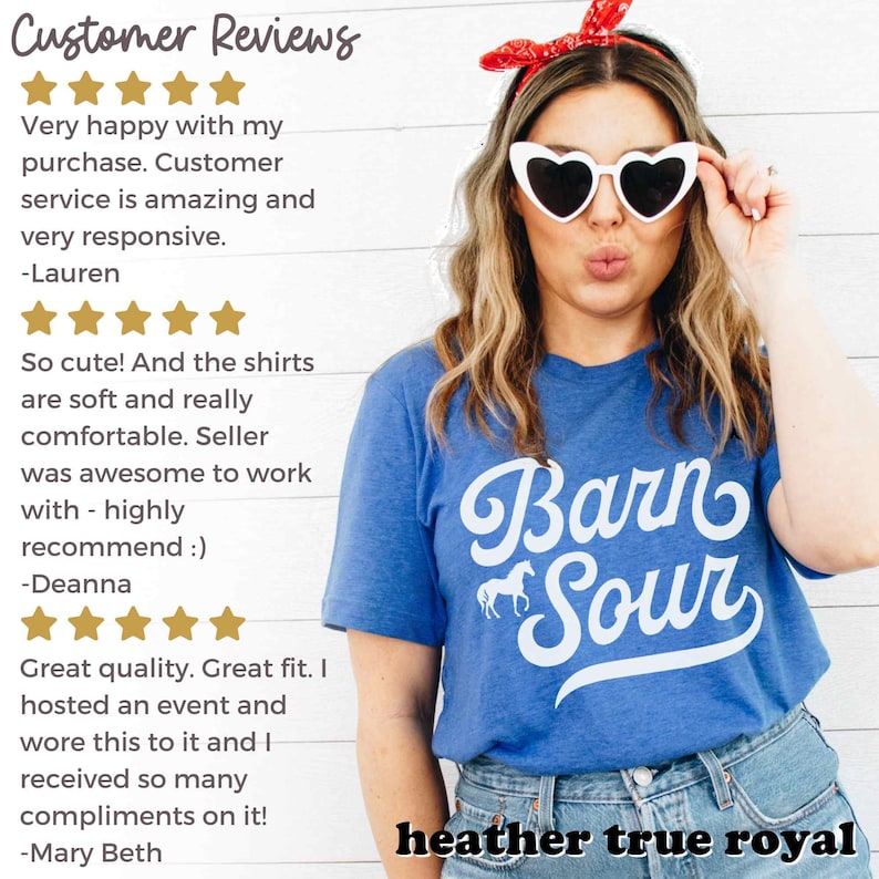 May include: A blue t-shirt with white text that reads "Barn Sour" and a small white horse graphic. The text is in a retro font. The model is wearing the shirt and has a red bandana in her hair and white heart-shaped sunglasses. The text "heather true royal" is at the bottom of the image.